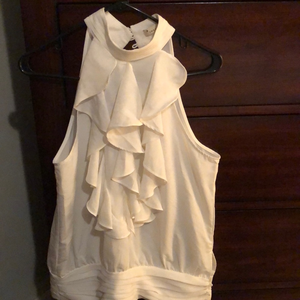 White sleeveless shirt with ruffles